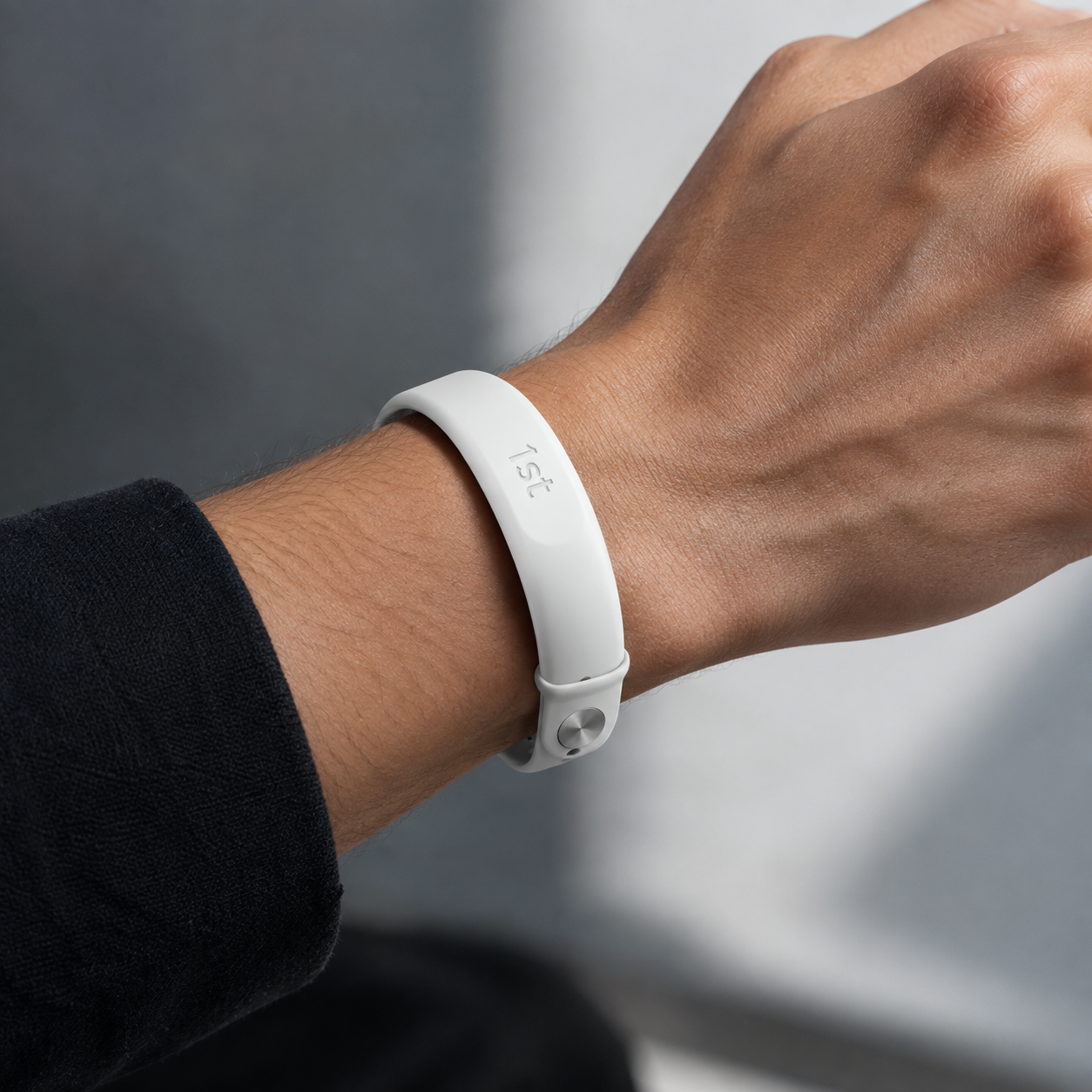 The 1st band in soft white worn on the wrist