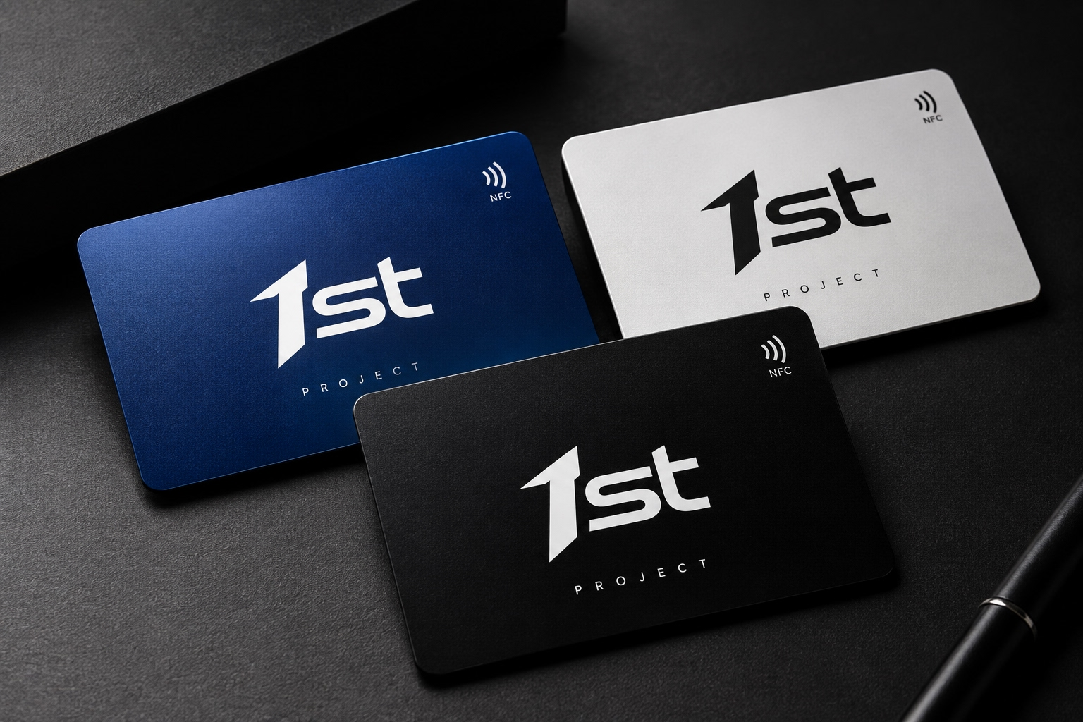 Three 1st Project NFC cards in navy, silver and black